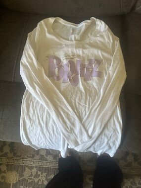 Nobo white long-sleeve graphic shirt featuring a purple "Bratz" logo across the